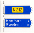 Beslissingswegwijzer langs niet-autosnelweg met interlokale doelen en routenummer niet-autosnelweg